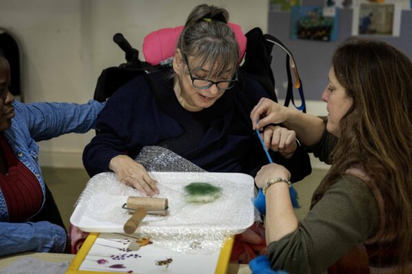 Freddie's Fibre Friends, Bowden Derra, Group activity with residents and staff layering felt sheets, promoting creativity and inclusion, @ThePark,