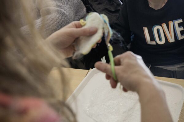 Freddie's Fibre Friends, Bowden Derra, Group activity with residents and staff layering felt sheets, promoting creativity and inclusion, @ThePark,