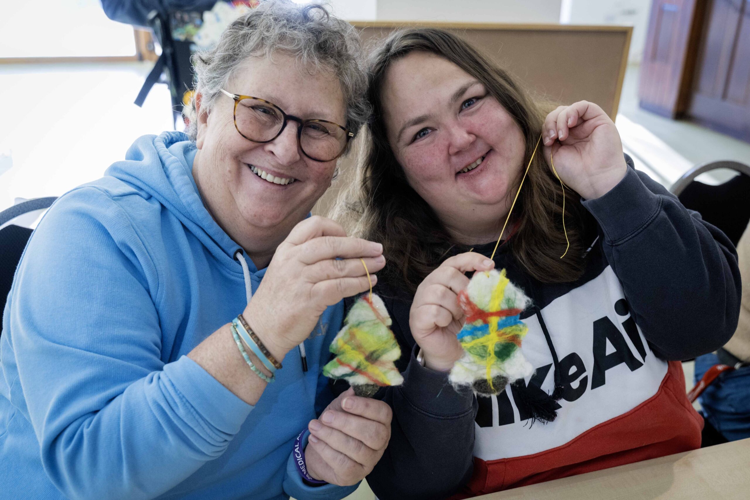 Freddie's Fibre Friends, Bowden Derra, Group activity with residents and staff layering felt sheets, promoting creativity and inclusion, @ThePark,